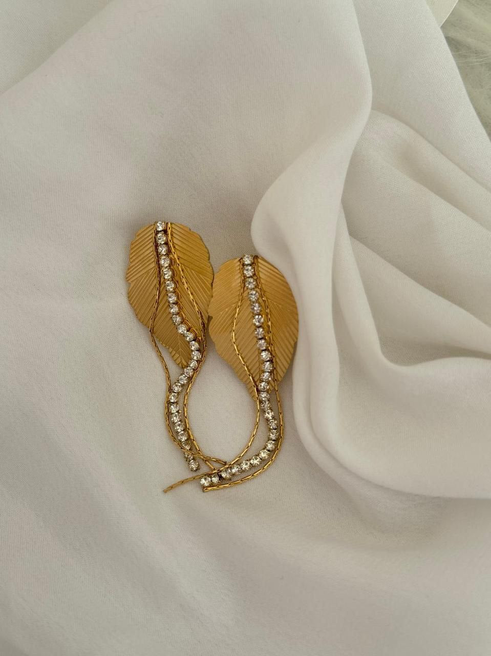 Elevate your accessory game with our stunning 22k gold plated leaf earrings CHARMORA BY ROHI