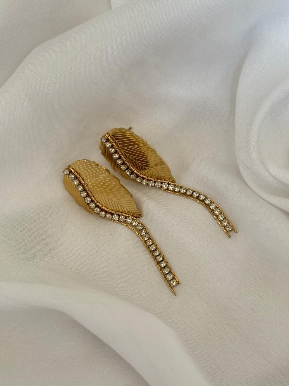 Elevate your accessory game with our stunning 22k gold plated leaf earrings CHARMORA BY ROHI