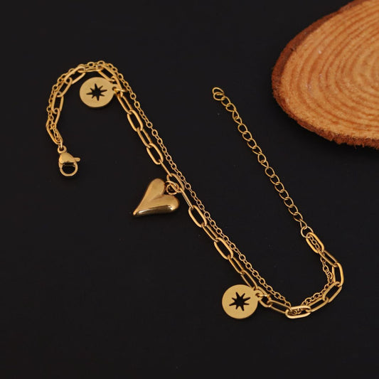22k gold plated anti tarnish , adorned with a whimsical heart charm and a sparkling star charm that add a touch of playful sophistication CHARMORA BY ROHI